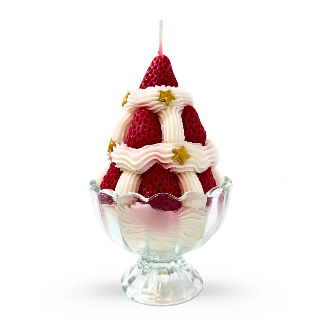 Strawberry Ice Cream–style novelty candle in a glass dessert cup with whipped cream details on a dark studio background, available at Shopeezy.