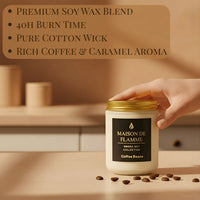 Thumbnail for Hand opening the white Coffee Beans scented candle on a warm-toned table — rich roasted coffee home fragrance.