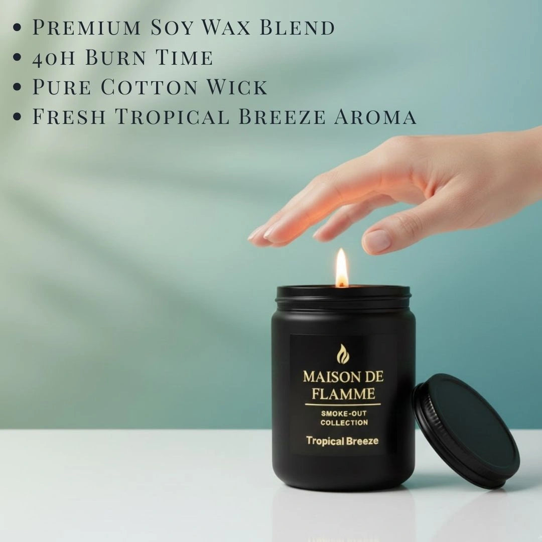 Hand lighting the black Tropical Breeze candle on a modern table — clean tropical citrus home fragrance.