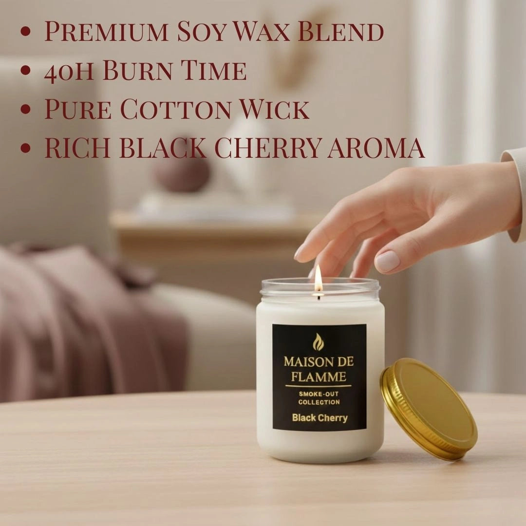 Hand reaching for the white Black Cherry candle on a wooden table — fruity deep cherry home fragrance.