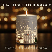 Thumbnail for Dual Light Technology showing real flame and LED artwork glow on Sandalwood candle – illuminated winter village design, available at Shopeezy.