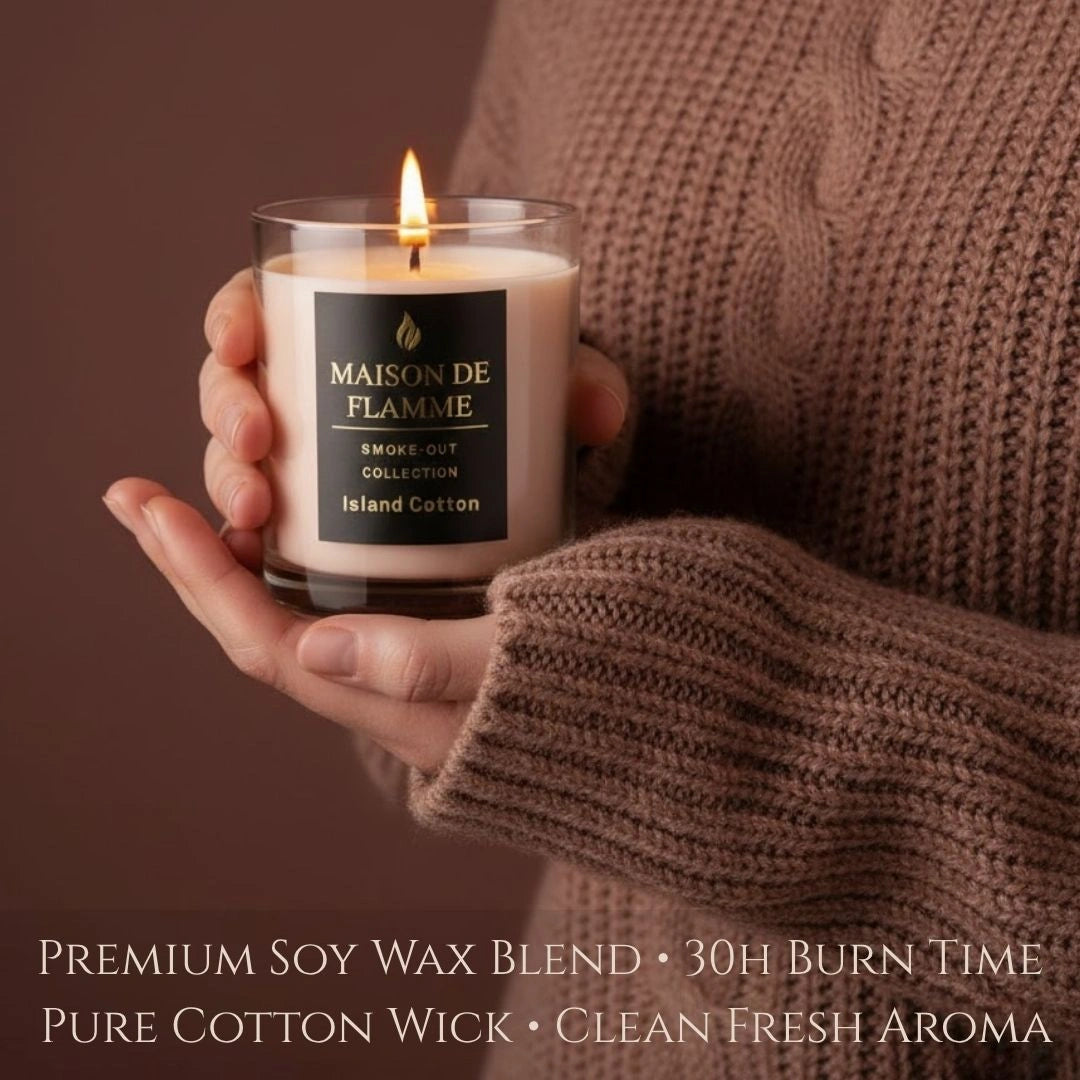 Island Cotton candle held in cozy sweater hands, warm soft cotton-inspired aroma aesthetic.