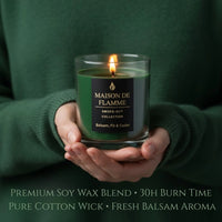 Thumbnail for Balsam, Fir & Cedar candle held in cozy hands with green sweater, fresh woodsy forest aroma mood.