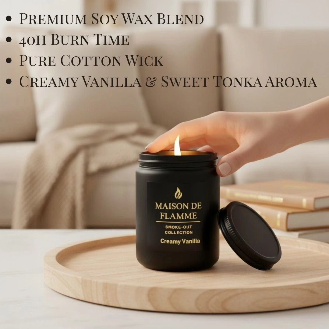 Hand reaching the black Creamy Vanilla scented candle — cozy warm vanilla home fragrance.