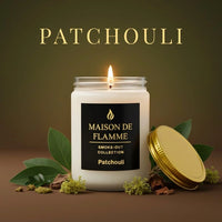Thumbnail for White Patchouli candle displayed with leaves and wood accents — warm earthy patchouli aroma.