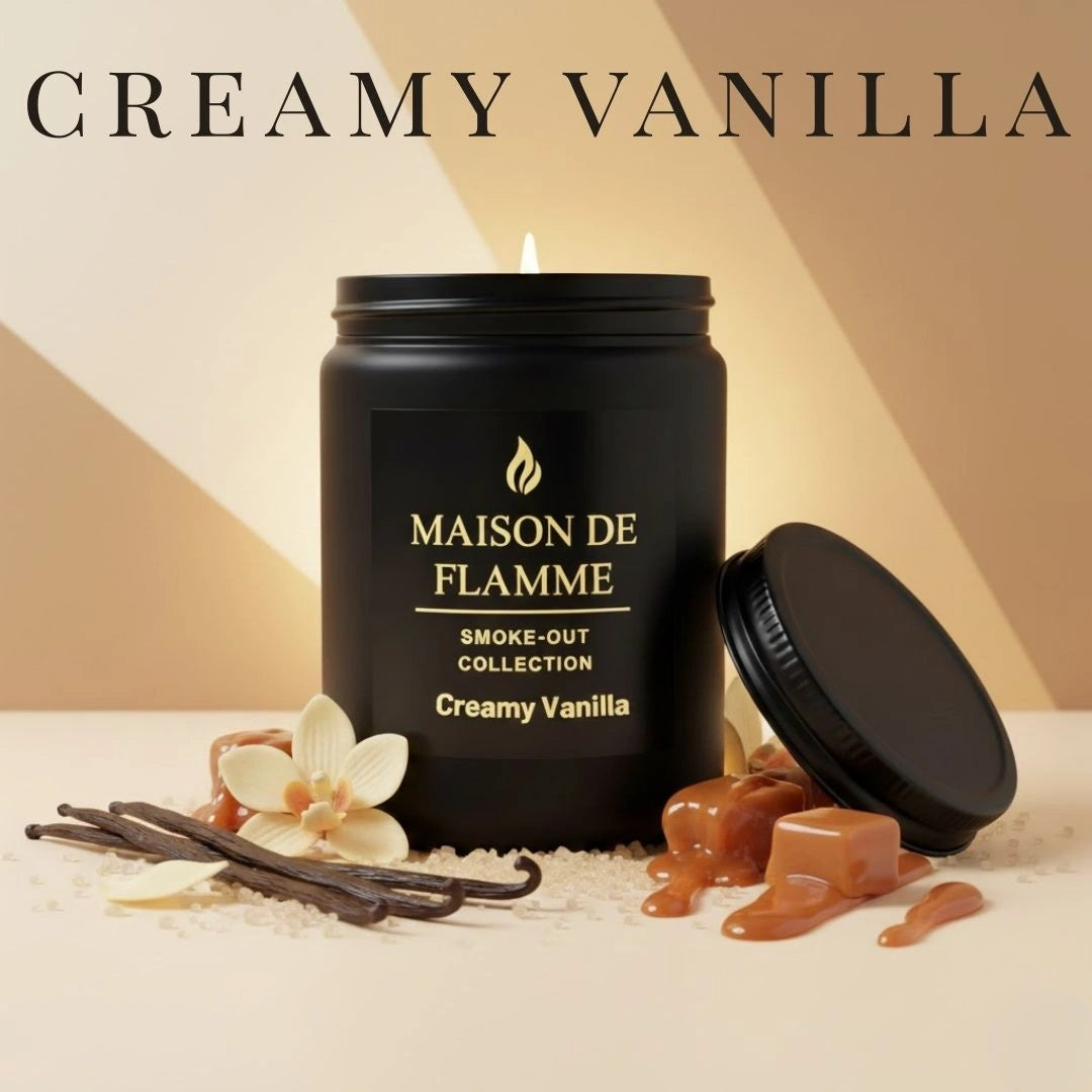 Black Creamy Vanilla candle surrounded by vanilla pods, caramel swirl, and warm spices — creamy vanilla fragrance notes.