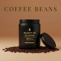 Thumbnail for Black Coffee Beans candle surrounded by roasted coffee beans and vanilla flower — rich coffee caramel fragrance notes.
