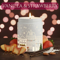Thumbnail for Vanilla & Strawberry candle glowing with strawberries, vanilla cream, and dessert elements in a warm festive setting, available at Shopeezy.