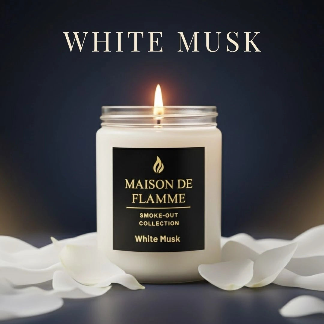 Maison de Flamme White Musk candle with white petals on a dark background