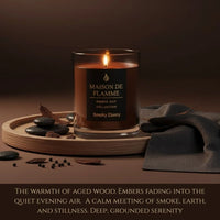 Thumbnail for Smoky Ebony candle styled with peppercorn, wood, and fabric, rich warm smoky aroma scene.