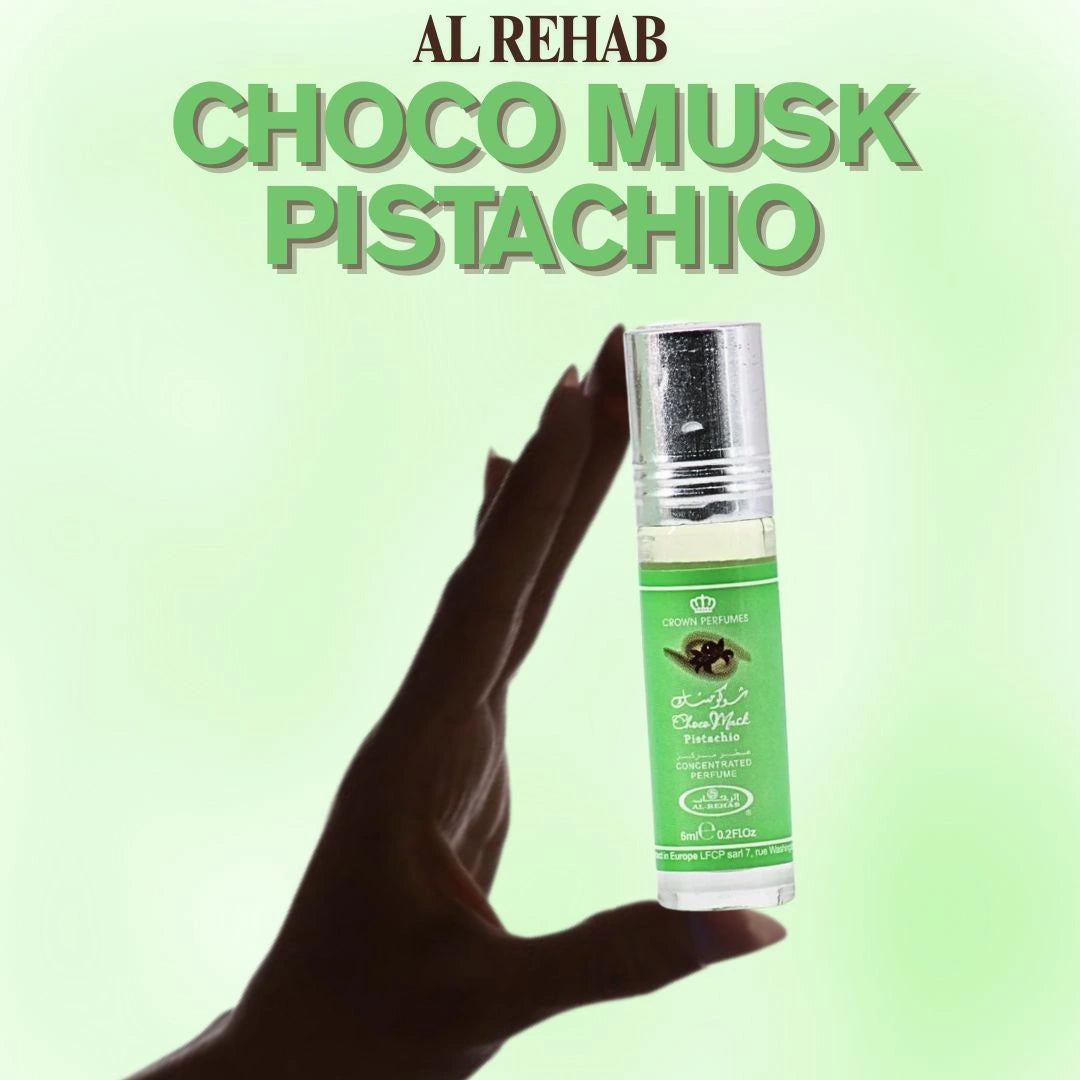 Hand holding Al Rehab Choco Musk Pistachio roll-on perfume oil 6ml, compact gourmand fragrance for everyday wear - Shopeezy
