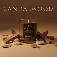 Thumbnail for Luxury Sandalwood scented candle styled with wooden sticks — calming earthy home fragrance.