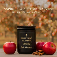 Thumbnail for Maison De Flamme Apple & Cinnamon candle with red apples on a warm fall table setup — cozy autumn soy wax candle.