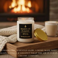 Thumbnail for Maison De Flamme Vanilla & Coconut candle next to a matching golden lid placed on a soft beige fabric with warm lighting.