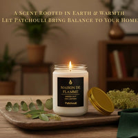 Thumbnail for White Patchouli candle displayed with leaves and wood accents — warm earthy patchouli aroma.