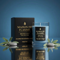 Thumbnail for Sea Salt & Sage candle with box in reflective blue studio setup decorated with sage leaves and sea elements.